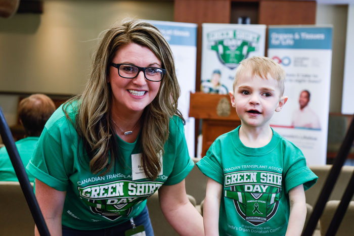 Photo of Liam and his mum at Green Shirt Day event in 2019